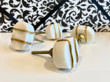 Set of 4 knobs white with gold wire wrap